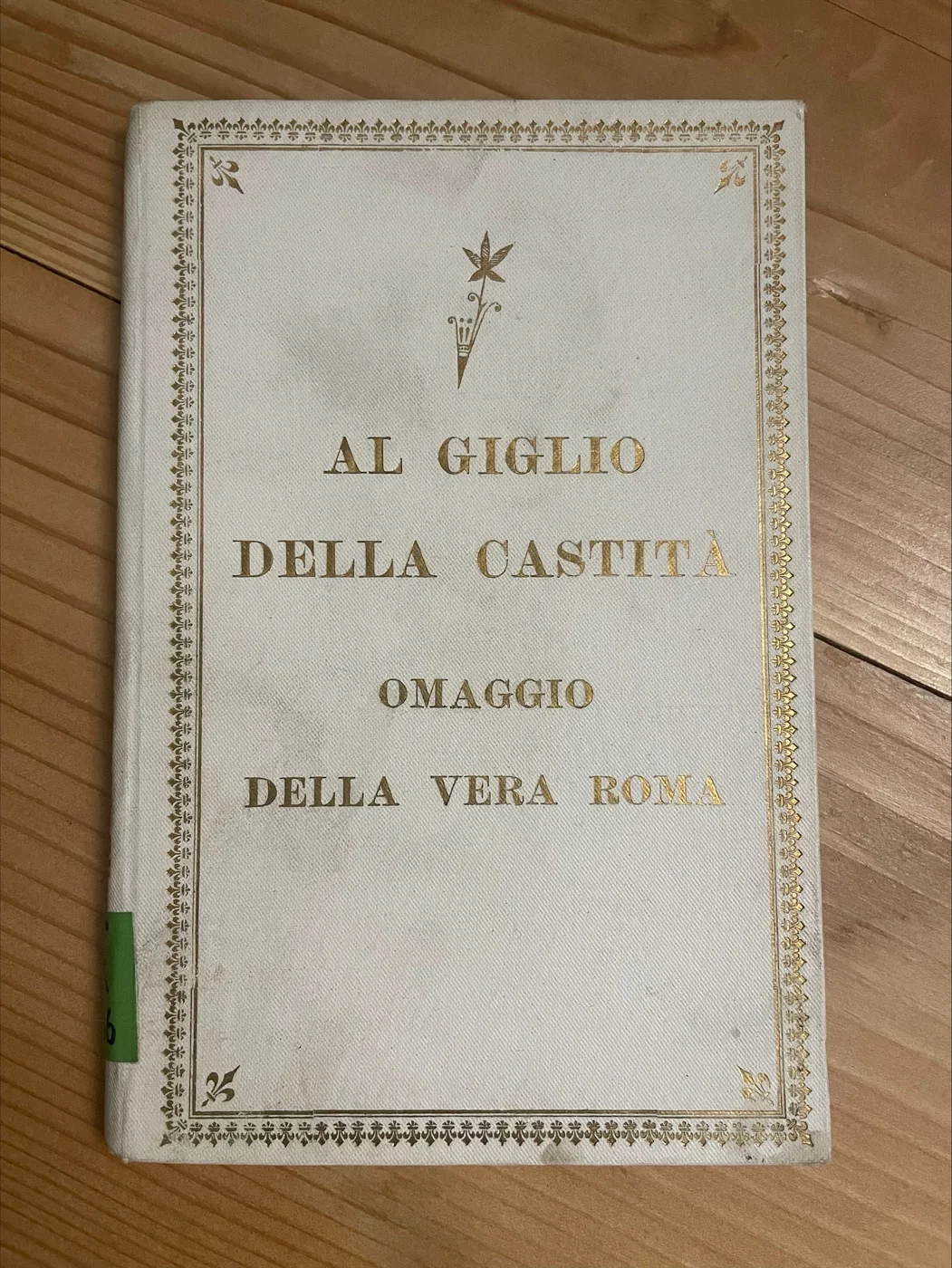 Gold-embossed cover of the 1904 Italian booklet "Al Giglio della Castita" (To the Lily of Chastity), a Vera Roma devotional tribute to Maria Goretti.
